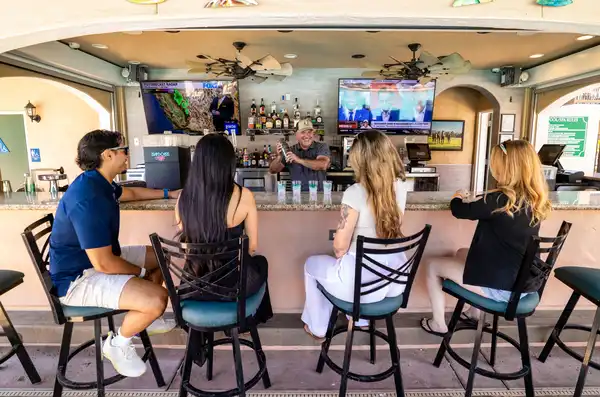 Harris Ranch guests seated at outdoor bar
